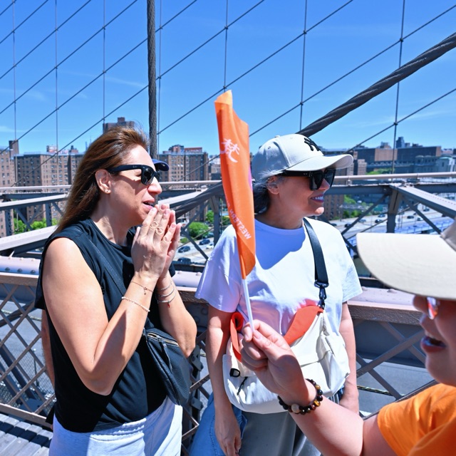 New Yorkers joining palms as the walk passes